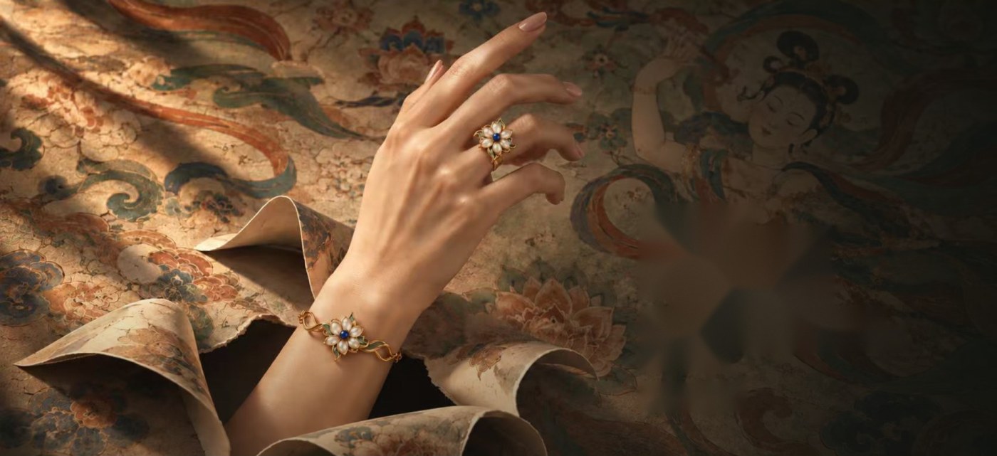 A hand against a Dunhuang mural
